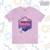 A purple D20 dice shape is behind bubbly hot pink text that says "Chaotic Bimbo". Sparkles and D20's surround the overall design. This is printed on a pastel pink t-shirt